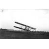 Wright transitional aircraft making a turn. Note top plane of canard has been removed.