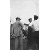 Walter Brookins (center) and unidentified men in front of Wright transitional aircraft.