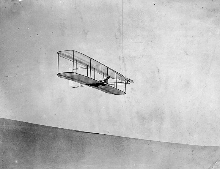 Wilbur Wright flying the 1902 glider, Kitty Hawk, North Carolina.