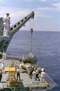Gemini 5 capsule hoisted onboard recovery ship