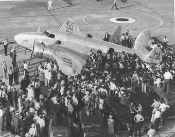 Hughes being greeted in New York after circling the globe