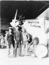 Four sailors pose with the Spirit of St. Louis