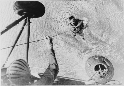 Alan Shepard being hoisted aboard ship after his flight