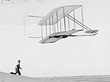Wilbur flying the 1902 glider,Dan Tate followingImage credit: Library of Congress